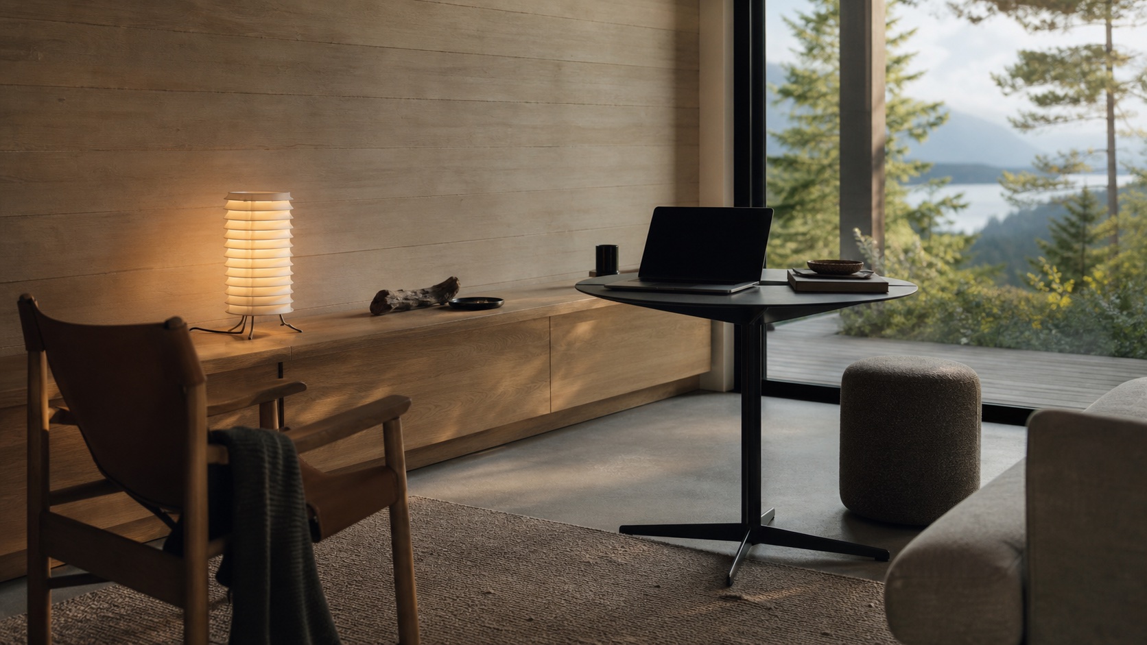 A calm modern living space where furniture, technology, and natural light meet quietly